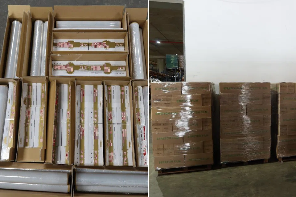 Beberapa karton rokok yang tidak dibayar cukai disembunyikan dalam kotak mengandungi gulungan plastik. Ia ditemui dalam sebuah gudang di Pandan Avenue.
