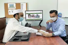 JIWA MASYARAKAT: Dr Abdul Qader Al-aidaroos (kiri) yang dulu merupakan saintis barah meningalkan tugas penyelidikan sepenuh masanya di A*Star selama 11 tahun untuk menyahut cabaran dalam bidang kerja sosial selaku Pengarah Eksekutif sepenuh masa MTFA. Beliau bersama Encik Saiful Karim (kanan), pengurus projek khas MTFA.- Foto MTFA dan fail