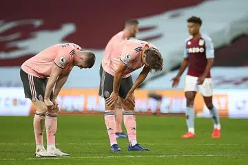 TEWAS: Pemain Sheffield United John Lundstram (kiri) dan Sander Berge kelihatan kecewa selepas perlawanan menentang Aston Villa. Sheffield United tewas1-0. - Foto REUTERS