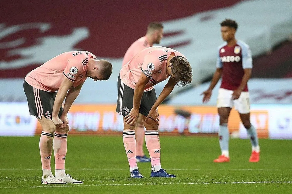 TEWAS: Pemain Sheffield United John Lundstram (kiri) dan Sander Berge kelihatan kecewa selepas perlawanan menentang Aston Villa. Sheffield United tewas1-0. - Foto REUTERS