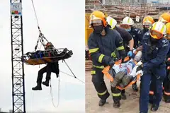 BERJAYA DISELAMATKAN: Pasukan SCDF telah berjaya menyelamatkan lelaki yang tercedera atas kren di ketinggian 40 meter. - Foto-foto SCDF 