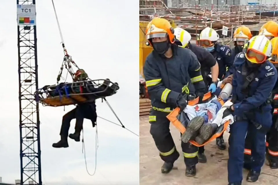 BERJAYA DISELAMATKAN: Pasukan SCDF telah berjaya menyelamatkan lelaki yang tercedera atas kren di ketinggian 40 meter. - Foto-foto SCDF 