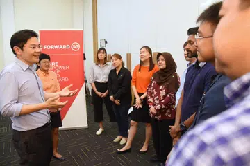 USAHA SAMA: Timbalan Perdana Menteri, Encik Lawrence Wong bertemu dengan pegawai perkhidmatan sosial untuk mendapatkan pandangan dan idea mereka tentang latihan ‘Melakar Hala Tuju Singapura’ di Institut Pembelajaran Sepanjang Hayat tahun lalu.