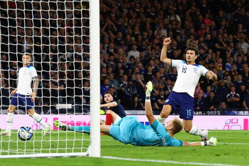 TIDAK MENGAPA: Pemain England, Harry Maguire, tertendang bola ke gawang pasukan sendiri semasa England mengatasi Scotland 3-1 dalam perlawanan persahabatan pada Selasa.