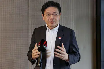 PELUANG JALIN PERSAHABATAN: Encik Lawrence Wong yakin hubungan akrab dengan pemimpin negara jiran di Malaysia akan membantu kededua pihak berbincang bagi mengatasi perbezaan dan terus memperkukuh hubungan dua hala. - Foto MCI