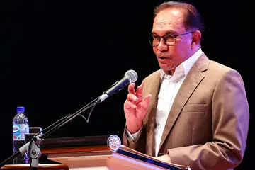 TERUSKAN DIALOG: Datuk Seri Anwar Ibrahim berkata kita tidak boleh selesaikan masalah dengan membakar atau mencemarkan kitab suci masing-masing, tetapi harus membaca dan menyertai dialog mengenainya.
