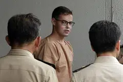 HADAPI TUDUHAN: David James Roach menghadapi tuduhan rompakan dan pengubahan wang haram. - Foto BANGKOK POST