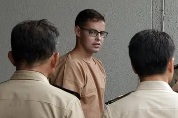HADAPI TUDUHAN: David James Roach menghadapi tuduhan rompakan dan pengubahan wang haram. - Foto BANGKOK POST