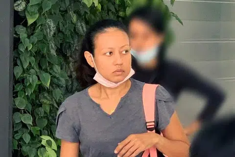 MENGAKU BERSALAH: Norhaini Abdul Majid mengaku bersalah atas empat pertuduhan rasuah melibatkan $1,870 dan dijatuhi hukuman penjara dua minggu.