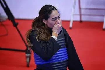 EMAS BERHARGA: Reaksi Suhaila selepas memenangi final acara tanding puteri kelas E di Gimnasium Bac Tu Liem kelmarin. - Foto BH oleh JASON QUAH 