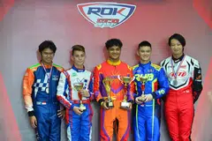 TEMPAT PERTAMA: Nooris Gafoor (tengah), yang telah berlumba dalam pelbagai pertandingan kereta ‘go-kart’, pernah menjuarai Piala Rok Asia 2023 Pusingan 2 dan Piala Rok Singapura 2023 Pusingan 3.