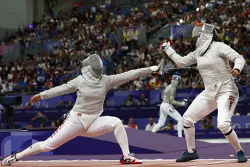 Nada Hafez (kanan) yang dilihat bersaing dengan Hayoung Jeon (kiri) dari Korea Selatan berkata beliau bukan sekadar bangga dengan penyertaannya, malah bersaing ketika beliau sedang hamil.