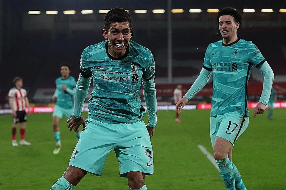 TAMAT KEMARAU KEMENANGAN: Firminho (kiri) meraikan gol kedua Liverpool dalam kemenangan 2-0 ke atas Sheffield United di Bramall Lane kelmarin. 