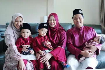 Cik Siti Nurohmah Wahyudin (kiri) akan menyambut Raya pertama bersama keluarga majikannya, (dari kanan) Encik Mohamad Iswandy Mohamad Ya’acob dan Cik Nur Syarfeena Mohd Fauzi bersama anak-anak mereka, Sofiyyah Azzahra (didukung), Ilhan Zaryf dan Aminul Bilhaq.