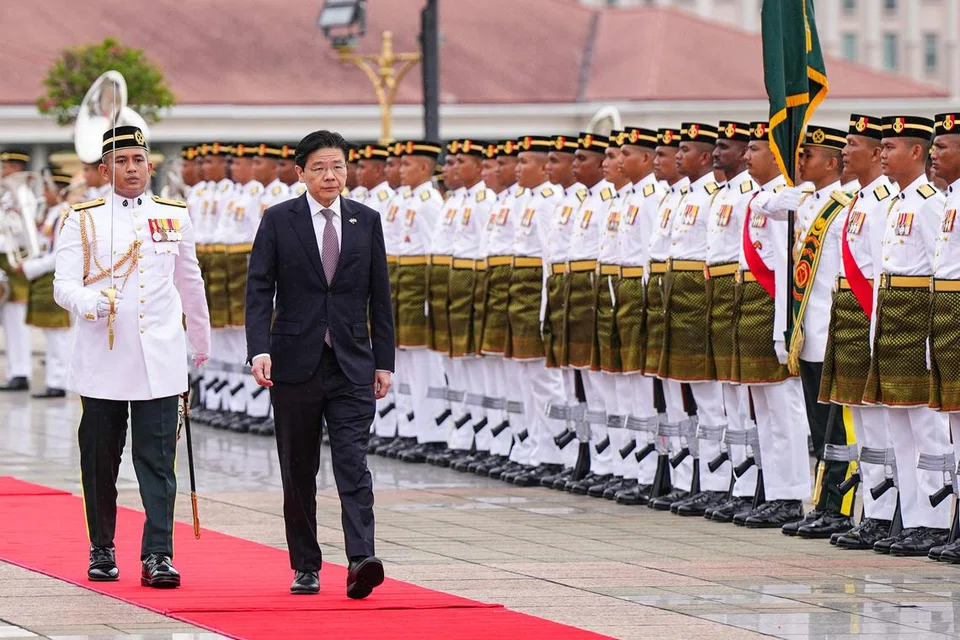 Perdana Menteri, Encik Lawrence Wong, menerima sambutan penuh istiadat setibanya beliau di Kompleks Perdana Putra bagi menghadiri Rahat Pemimpin Malaysia-Singapura ke-11 di Putrajaya.