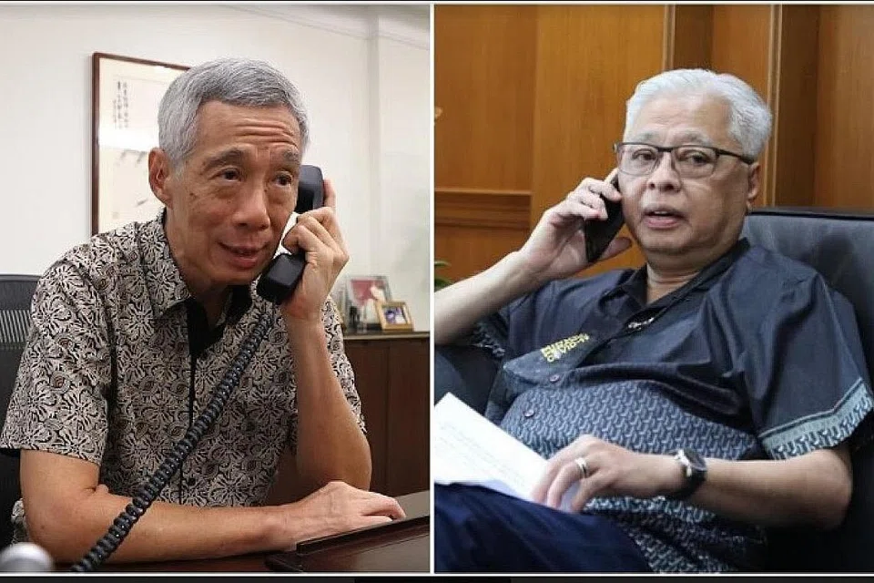 TANDA JALINAN ERAT: PM Lee (kiri) mengucapkan tahniah kepada Datuk Seri Ismail Sabri Yaakob (kanan) atas pelantikannya sebagai Perdana Menteri Malaysia dalam panggilan yang dibuat semalam. - Foto FACEBOOK PM LEE