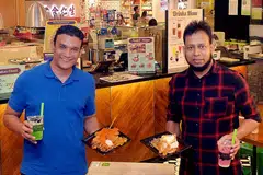 SEMAKIN LARIS: Pengasas Crave Nasi Lemak, Encik Abdul Malik Hassan (kiri), berkata nasi lemaknya semakin laris selepas McDonald's memperkenal makanan Burger Nasi Lemak. Bersama beliau ialah rakan niaganya, Encik Mohamed Rafeek. - Foto-foto fail