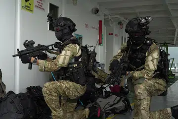 Dua pegawai Pasukan Bertindak Operasi Khas dilihat telah menaiki sebuah kapal perdagangan setelah ia dirampas pengganas semasa latihan.