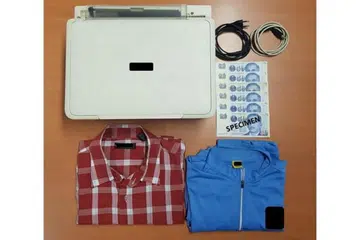 KES WANG PALSU: Enam wang $50 yang dipercayai palsu, sebuah mesin pencetak, beberapa kertas dan pakaian turut dirampas polis.