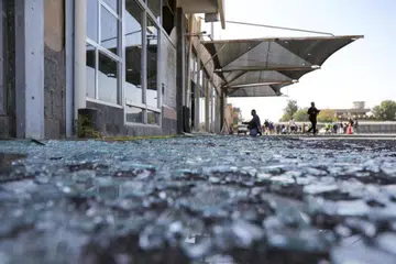 Kaca pecah bertaburan di atas tanah berhampiran bangunan rosak Lapangan Terbang Sanaa, berikutan serangan udara Israel di Sanaa, Yaman pada 27 Disember.