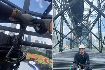 Encik Daniel Amyrul Abdullah, 25 tahun, dari Kuala Lumpur kelihatan bertugas di landasan tinggi struktur stadium yang disediakan di Padang bagi Perbarisan Hari Kebangsaan 2024.