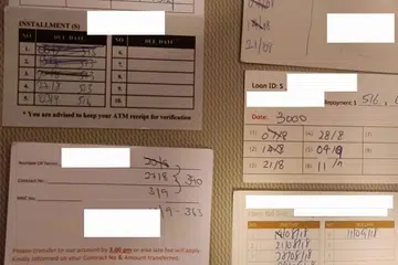 LINTAH DARAT CERUT PEMINJAM: Kad-kad rekod hutang menunjukkan firma-firma kredit memaksa peminjam membayar balik hutang secara mingguan - sesuatu yang melanggar peraturan. - Foto-foto BM oleh SAINI SALLEH