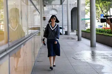DIDAPATI BERSALAH: Bekas pengurus kewangan Gereja City Harvest, Sharon Tan, yang hadir di Mahkamah Tinggi hari ini bagi memohon memulakan hukuman penjara lebih awal diberi kebenaran untuk berbuat demikian. - Foto THE STRAITS TIMES