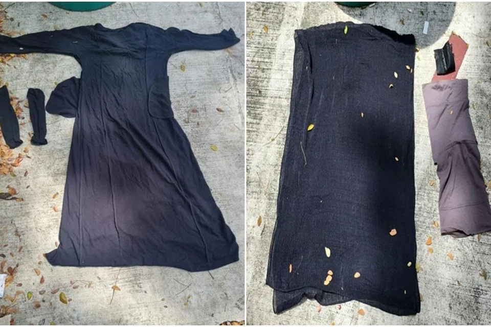 GAGAL MEROMPAK: Polis merampas baju labuh lengan panjang berwarna hitam, tudung dan sarung tangan yang dikenakan suspek semasa dia cuba merompak minimart di Lorong 1 Toa Payoh.