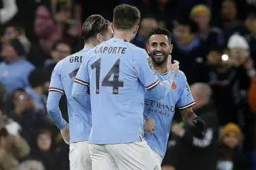 TERUS MARA: Mahrez (paling kanan) meraikan golnya bersama rakan sepasukan Aymeric Laporte dan Jack Grealish dalam kemenangan 2-0 Manchester City ke atas Chelsea di Stadium Etihad kelmarin. - Foto REUTERS