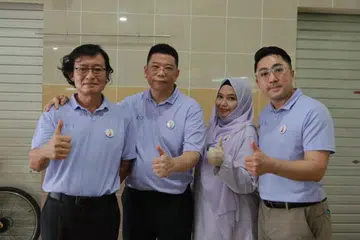 Anggota Parti Kuasa Rakyat (dari kiri) Encik Martinn Ho, Encik Peter Soh, Cik Arbaah Haroun dan Encik Derrick Sim, selepas sesi berinteraksi dengan penduduk di Pasar Bulat dan Pusat Makanan Tampines pada 12 April.
