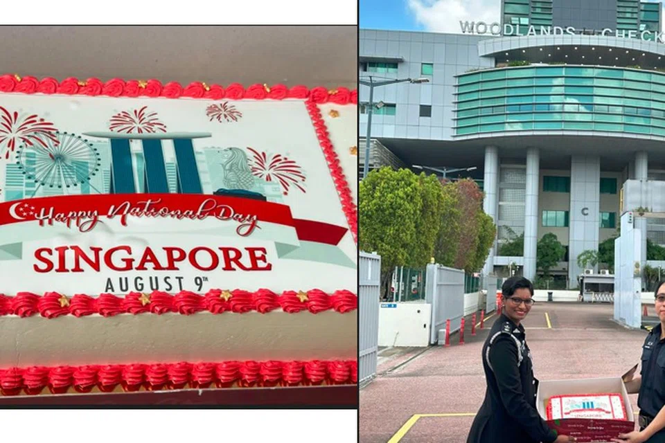 HADIAHKAN KEK: Timbalan Ketua Imigresen Bangunan Sultan Iskandar, dikenal pasti sebagai Puan Vimala telah menyerahkan kek kepada Timbalan Komander Woodlands Tong Weijie di Pusat Pemeriksaan Woodlands sempena ulang tahun Singapura ke-58. 