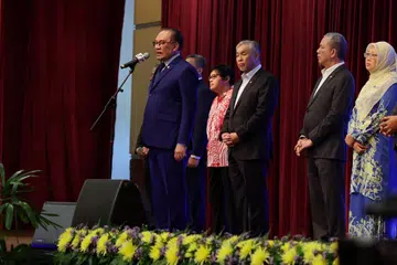 Perdana Menteri Malaysia, Datuk Seri Anwar Ibrahim (kiri), ketika berucap pada Majlis Perjumpaan Perdana Menteri bersama Warga Kerja Jabatan Perdana Menteri (JPM) bagi Bulan September 2024 di Puspanitapuri pada 2 September.