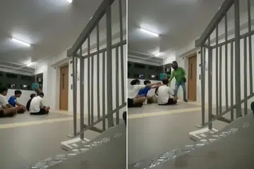 Sekumpulan remaja duduk di hadapan pintu lif di sebuah lobi lif di Bukit Batok untuk menyambut kedatangan seorang pekerja penghantaran yang ditugaskan untuk memenuhi tempahan mereka.