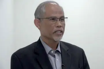 Menteri Bertanggungjawab Bagi Ehwal Masyarakat Islam, Encik Masagos Zulkifli Masagos Mohamad (gambar atas). - Foto melalui tangkap layar video