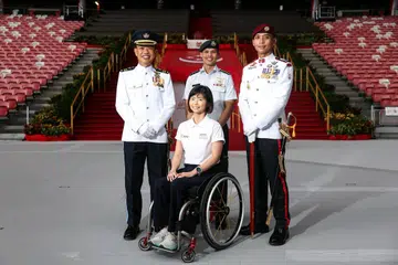 *EMBARGO UNTIL 3PM* (From left) Military Expert 6 Caleb Chia, 43, NDP parade commander, Colonel Anthony Lau, 45, NDP Parade and Ceremony Committee chairman, Yap Qian Yin, 35, a civilian contingent participant from the Singapore Disability Sports Council, and Master Warrant Officer Low Kay Kee, 44,  parade regimental sergeant major, during the Parade & Ceremony media event at National Stadium on June 25, 2026. ST PHOTO: BRIAN TEO