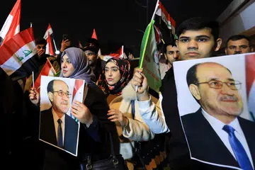 Penyokong bekas Perdana Menteri Iraq, Nouri al-Maliki, berhimpun membantah terhadap tindakan yang mereka dakwa sebagai campur tangan Amerika Syarikat terhadap kedaulatan Iraq berhampiran pintu masuk Zon Hijau yang menempatkan Kedutaan Amerika Syarikat dan misi diplomatik lain di Baghdad, Iraq, pada 29 Januari 2026. 