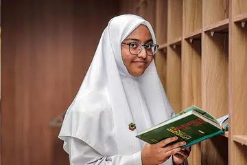POSITIF COVID SEMASA PEPERIKSAAN:Cik Aminah sekeluarga dijangkiti Covid-19 semasa tempoh peperiksaan, namun ini bukan penghalang baginya untuk mencapai kecemerlangan.- Foto-foto BH oleh NUR DIYANA TAHA