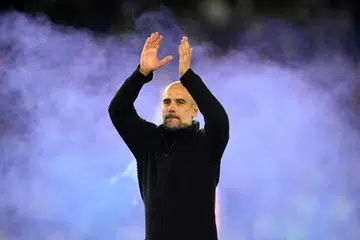 BURU TIGA KALI JUARA: Pengurus Manchester City, Pep Guardiola, sedang memburu ‘treble’ setelah memenangi EPL dan Piala FA.