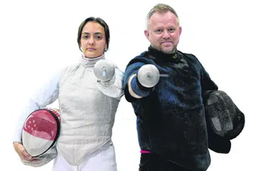 Amita Berthier (kiri) telah kembali dari Amerika Syarikat ke Singapura untuk berlatih dengan ketua jurulatih acara foil nasional, Oleg Matseichuk.