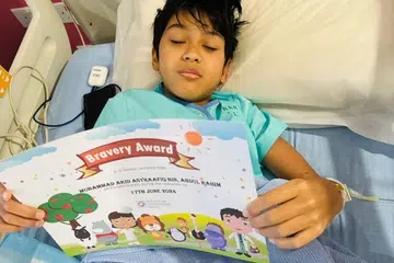 Keadaan Muhammad Akid Asyraafiq Abdul Rahim selepas jalani pembedahan pertama pada Hari Raya Haji 2024.