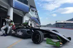 SIAP BERJUANG: Daim bergambar dengan kereta perlumbaan F4-nya sebelum menjalani sesi latihan di Litar Antarabangsa Ningbo semalam. - Foto BLACKARTS RACING