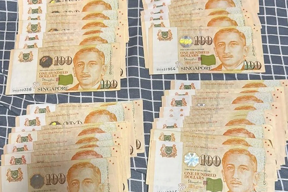 DIRAMPAS: Antara bahan bukti yang dirampas polis dalam satu operasi iaitu wang tunai berjumlah $3,800.