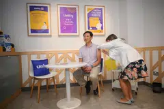 Menteri Kesihatan, Encik Ong Ye Kung, menerima suntikan vaksin di farmasi Unity dalam pasar raya FairPrice Xtra di Parkway Parade pada 28 Oktober.