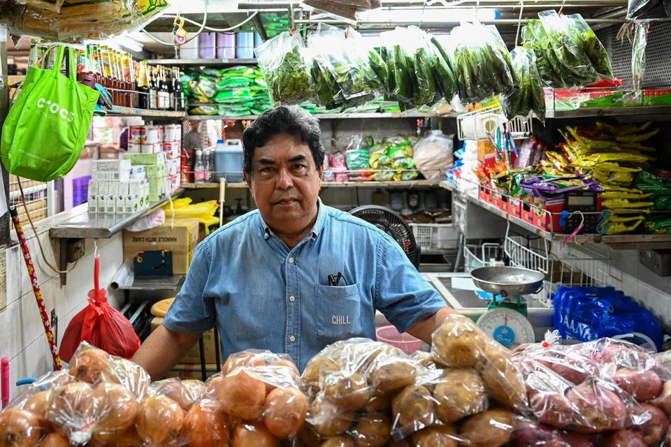 Peniaga sayur, Encik Anwar Sulaiman, 67 tahun, akan meneruskan perniagaannya di kedai beliau yang terletak di Tampines.