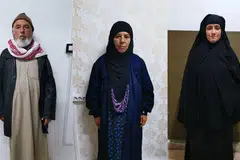 DITAHAN: (Dari kiri) Lelaki yang dipercayai suami Rasmiya Awad, kakak Baghdadi; Rasmiya Awad (tengah) dan wanita yang dipercayai anak menantu Rasmiya Awad. - Foto-foto EPA-EFE