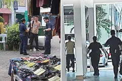 Lelaki yang didakwa mengemis (tengah) tenang apabila disoal siasat polis.