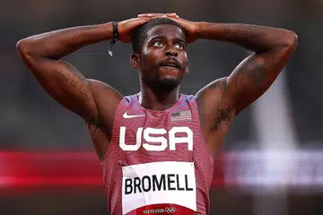 SUKAR UNTUK PERCAYA: Salah seorang pelari 4x100 meter AS Trayvon Bromell menunjukkan reaksinya selepas perlumbaan. - Foto REUTERS