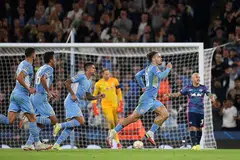 RAIKAN GOL: Pemain tengah Manchester City, Jack Grealish (kanan) meraikan jaringannya ketika berdepan RB Leipzig di Stadium Etihad dekat Manchester. - AFP