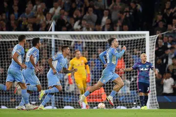 RAIKAN GOL: Pemain tengah Manchester City, Jack Grealish (kanan) meraikan jaringannya ketika berdepan RB Leipzig di Stadium Etihad dekat Manchester. - AFP