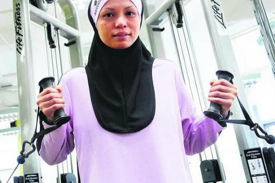 PROGRAM UNTUK MUSLIMAH: Cik Muzdalifah Anuar, yang berhenti kerja sebagai kapten bahagian infantri SAF atas faktor mahu meluangkan masa bersama keluarga dan memakai hijab sepenuh masa, kini membuka syarikat PopWow yang menawarkan empat program untuk wanita. - Foto TAUFIK A. KADER